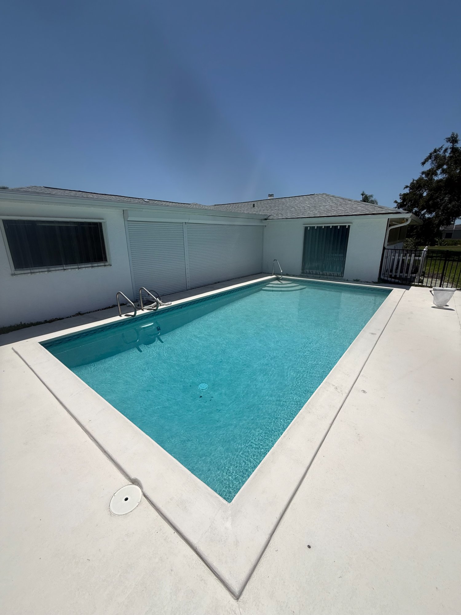 Crystal clear residential pool maintained by Luxe Aquatic
